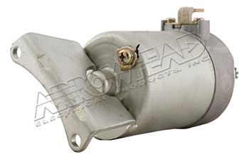 Silver motorcycle starter motor with mounting flange and electrical connections
