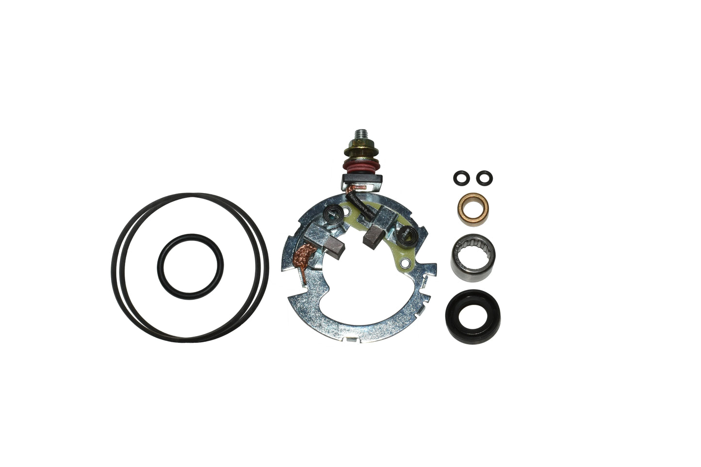 metallic electrical starter brush holder with carbon brushes and various rubber O-rings and seals on white background