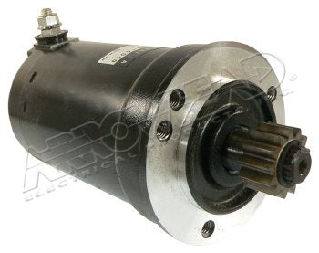 Close-up of black Ducati starter motor with silver mounting flange and gear teeth