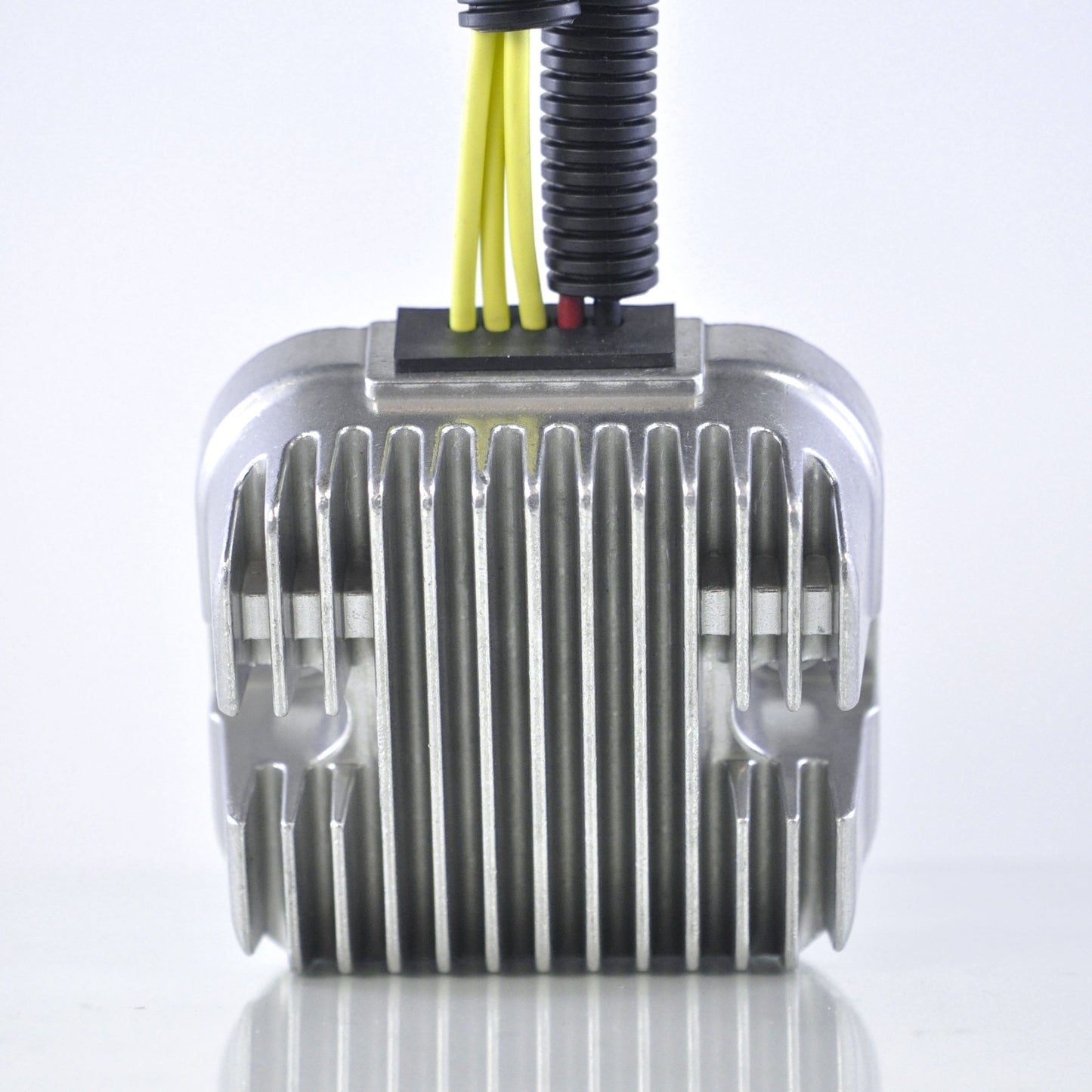 Close-up of a silver Mosfet voltage regulator rectifier with yellow and black wires