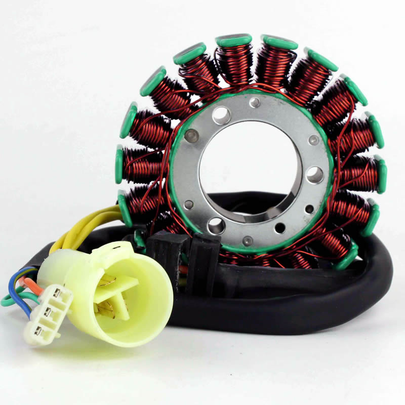 circular copper wire stator coil with green caps and attached electrical connector on white background