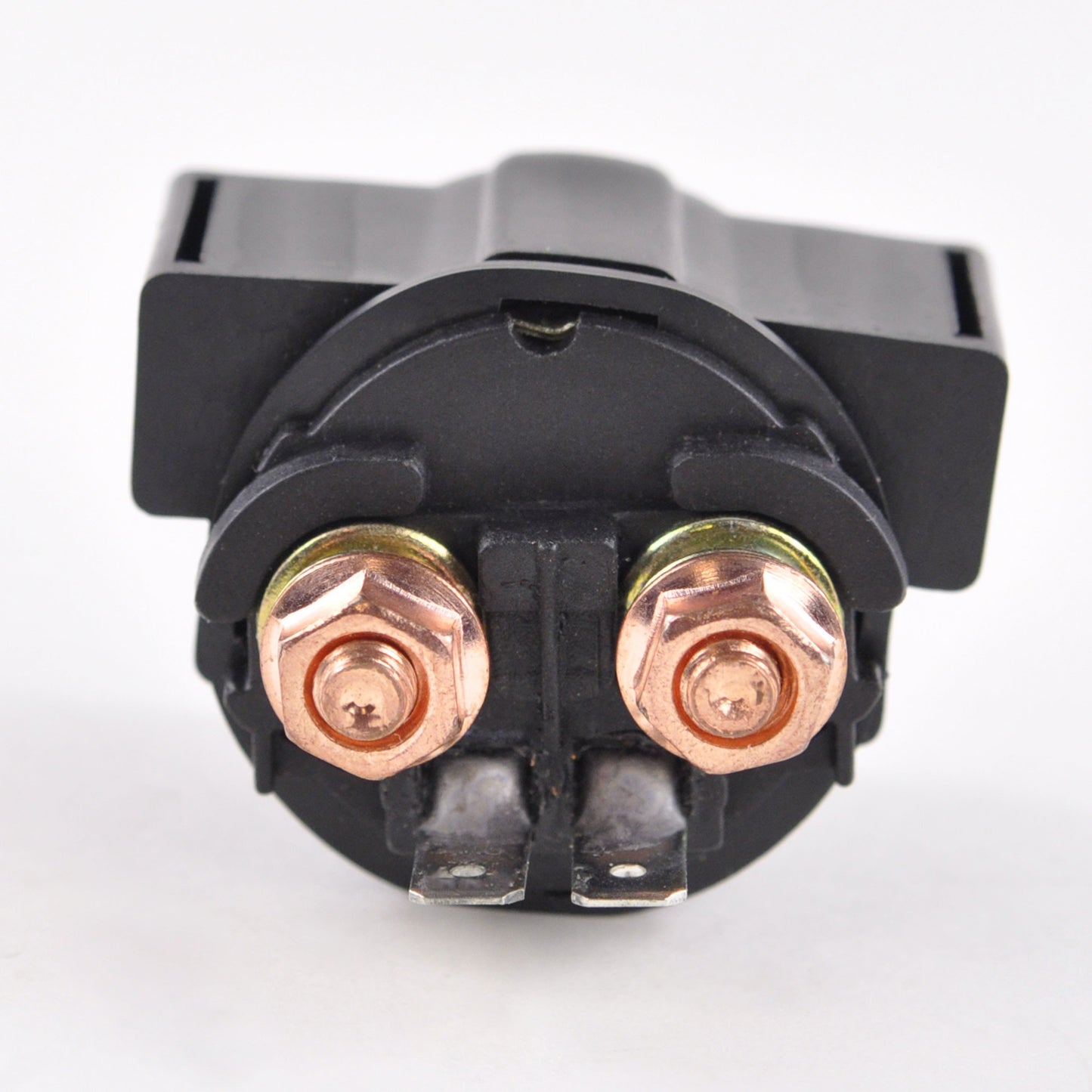 Close-up of a black solenoid with copper terminals for Kawasaki Bayou 300 Brute Force 650