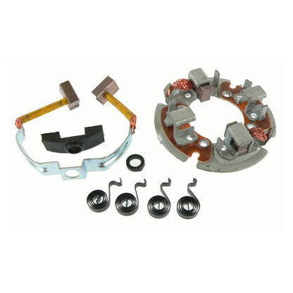 Starter motor brush holder kit including springs, brush holder plate, and carbon brushes on white background