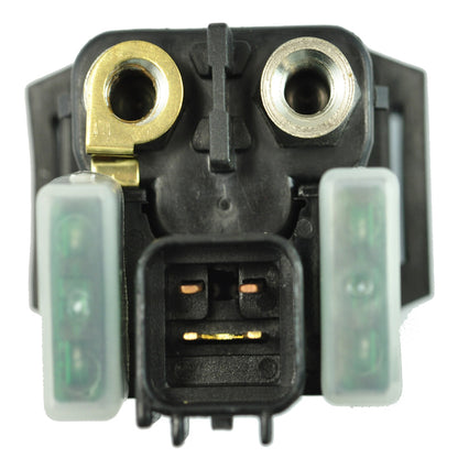 Close-up of black electrical connector with brass and silver terminals and two transparent fuses