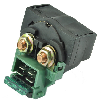 black and green electrical relay with copper terminals and fuse on white background