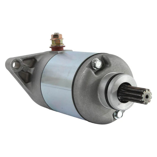 Close-up of a new silver and gray automotive starter motor with gear teeth and mounting bracket