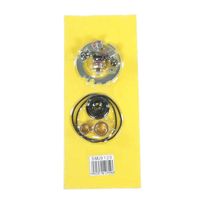 SMU9120 carburetor repair kit with gaskets and metal parts on yellow backing